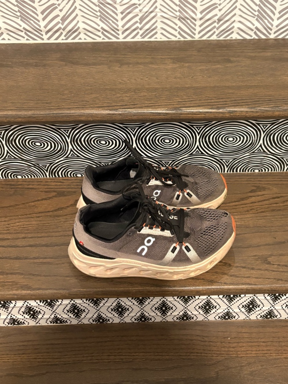 On Running Women's Gray and Black Cloud Running Shoes with Orange Accents